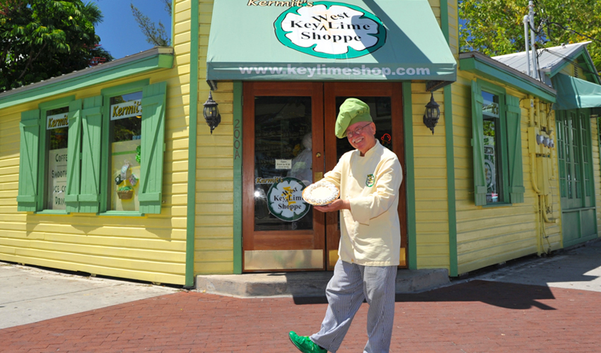Man holding pie in front of Kermits Key West Key Lime Shoppe